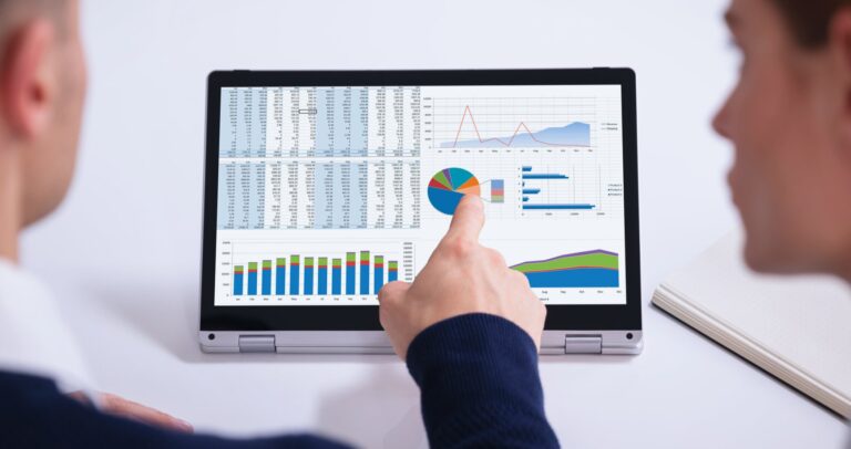 business owner looking at dashboard - Understanding the Importance of Tracking Revenue Sources in Home Service Businesses